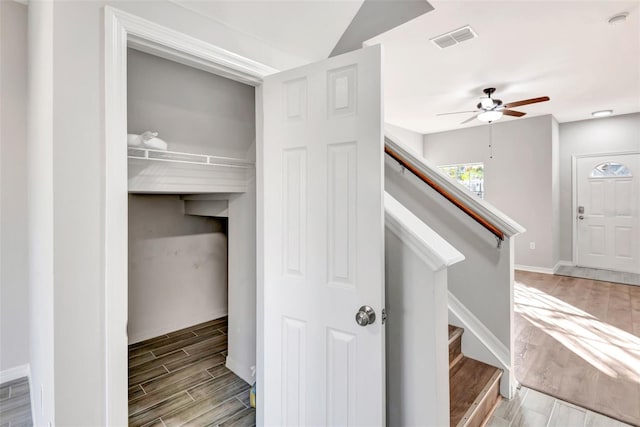 interior space featuring ceiling fan