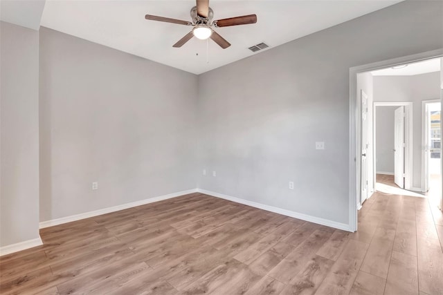 spare room featuring ceiling fan and light hardwood / wood-style floors