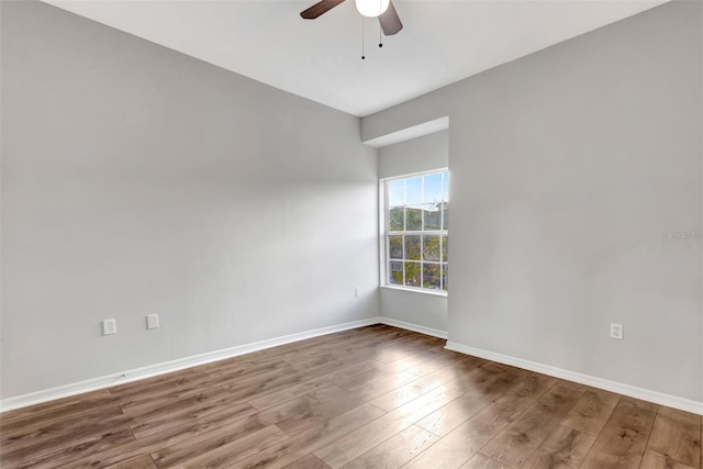 empty room with wood-type flooring and ceiling fan