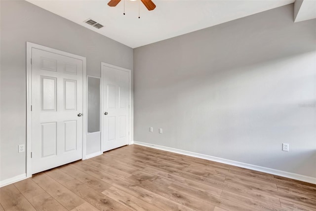 unfurnished bedroom featuring light hardwood / wood-style floors and ceiling fan