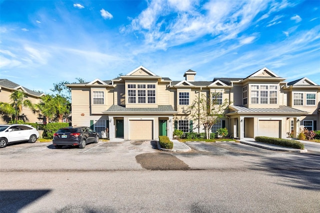 multi unit property featuring a garage