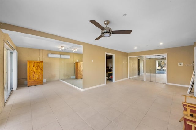 unfurnished room featuring ceiling fan and light tile patterned floors