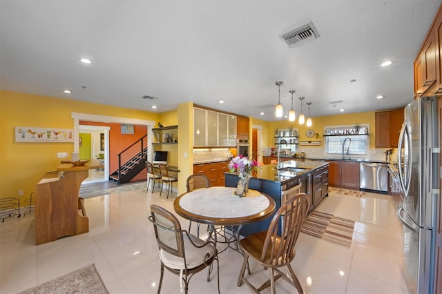 tiled dining room with sink