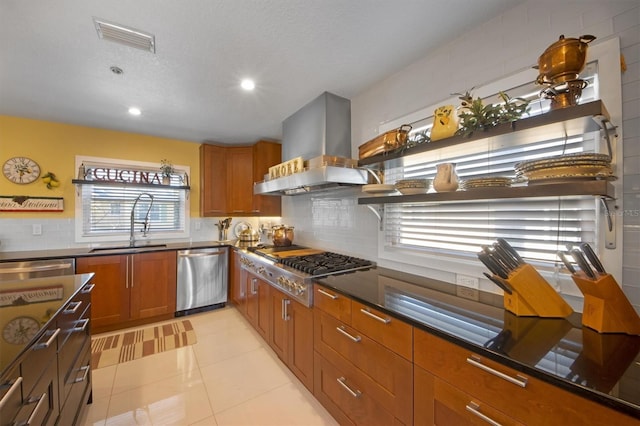 kitchen with stainless steel appliances, island exhaust hood, sink, and decorative backsplash