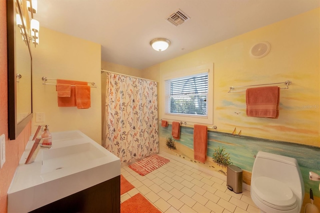 bathroom with vanity, toilet, and curtained shower