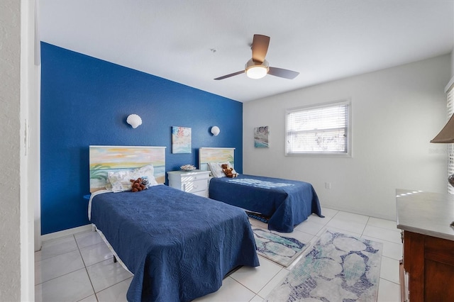 bedroom featuring light tile patterned flooring and ceiling fan