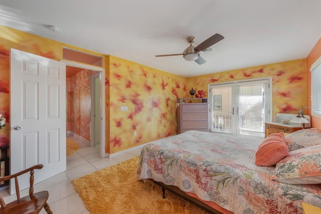 tiled bedroom with french doors and ceiling fan