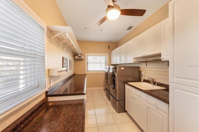 laundry area featuring sink, washer and clothes dryer, ceiling fan, and light tile patterned flooring