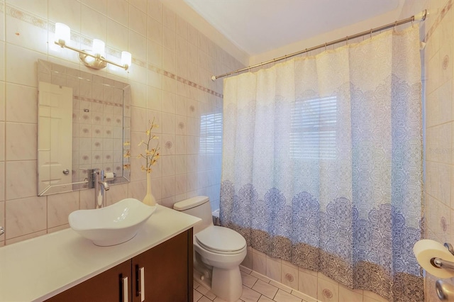 full bathroom featuring toilet, tile walls, vanity, shower / bath combo, and tile patterned flooring