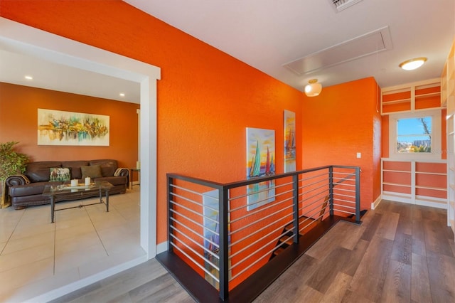 corridor featuring hardwood / wood-style floors