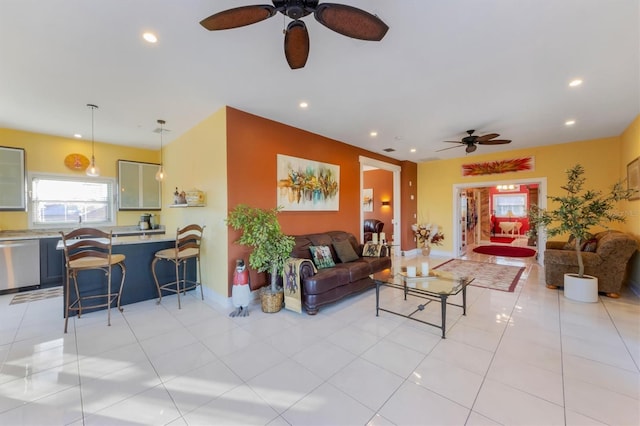 living room featuring ceiling fan and light tile patterned floors