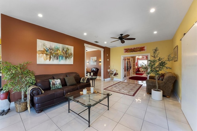 tiled living room featuring ceiling fan