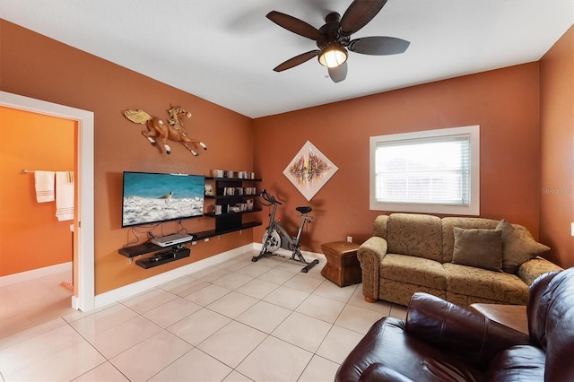 tiled living room featuring ceiling fan