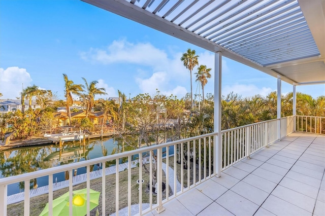 balcony featuring a water view