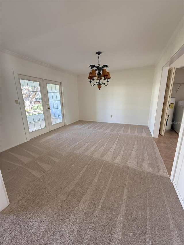 empty room with light carpet, a notable chandelier, and french doors