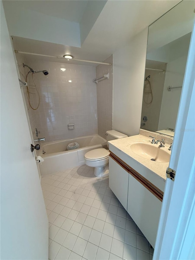 full bathroom with vanity, toilet, tiled shower / bath combo, and tile patterned flooring