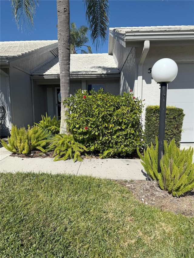 view of home's exterior with a yard