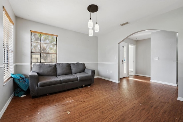 living room with dark hardwood / wood-style flooring