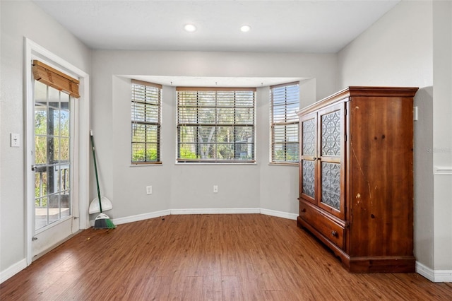 spare room with hardwood / wood-style floors