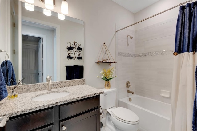 full bathroom featuring vanity, shower / tub combo with curtain, and toilet