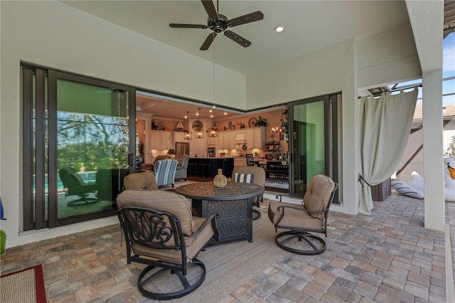 view of patio / terrace featuring ceiling fan