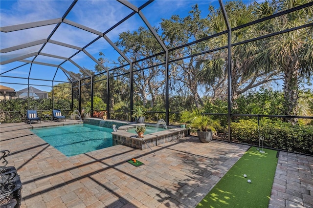 view of swimming pool featuring an in ground hot tub, pool water feature, a patio, and glass enclosure