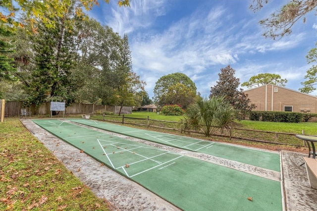 view of property's community with a yard