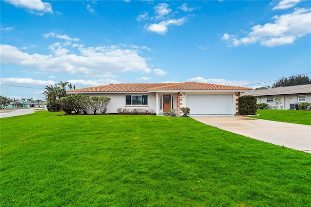 ranch-style home with a garage and a front yard