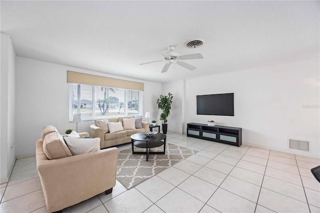 tiled living room featuring ceiling fan