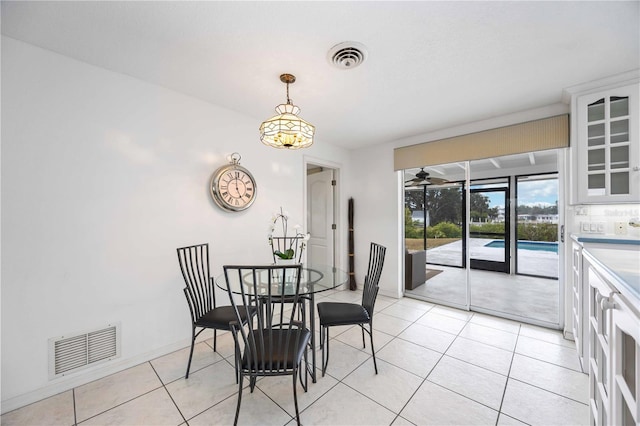 dining area with light tile patterned floors