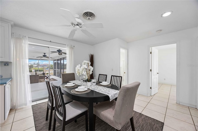 dining room featuring light tile patterned floors and ceiling fan