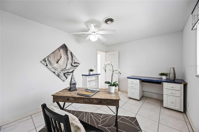 tiled office space with ceiling fan