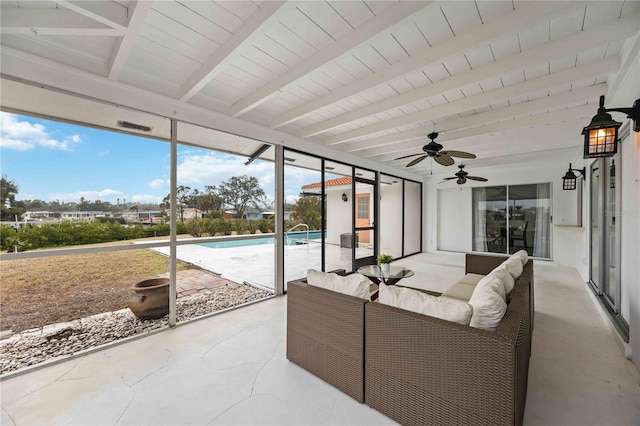 sunroom featuring beamed ceiling