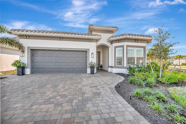 mediterranean / spanish-style home featuring a garage