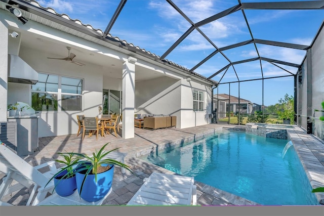 view of pool with pool water feature, area for grilling, an in ground hot tub, ceiling fan, and a patio