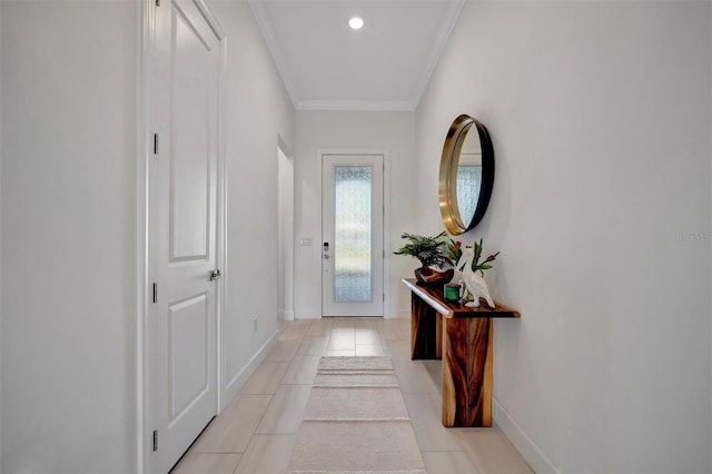 doorway featuring crown molding and light tile patterned floors