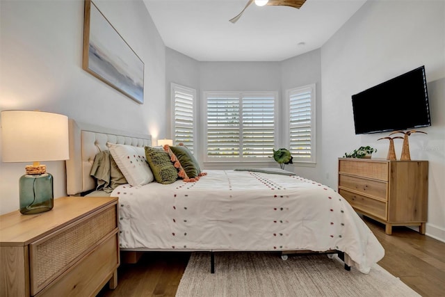 bedroom featuring hardwood / wood-style floors and ceiling fan