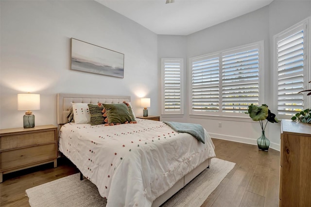 bedroom with hardwood / wood-style floors