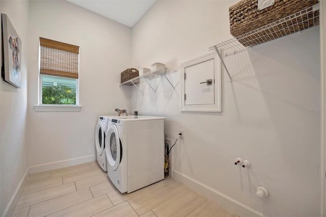 washroom featuring washer and clothes dryer