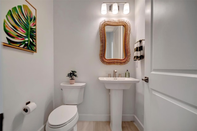 bathroom featuring sink and toilet