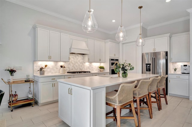 kitchen with white cabinetry, appliances with stainless steel finishes, and custom exhaust hood