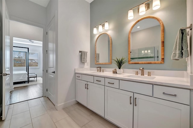 bathroom with vanity and tile patterned flooring