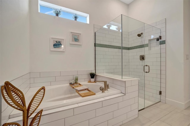 bathroom with tile patterned floors and independent shower and bath