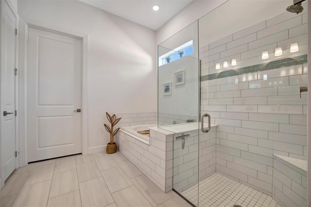 bathroom with tile patterned floors and plus walk in shower