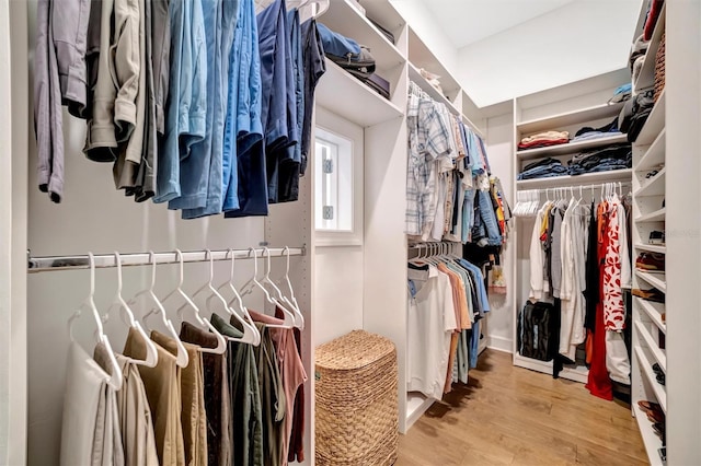 walk in closet featuring light hardwood / wood-style floors