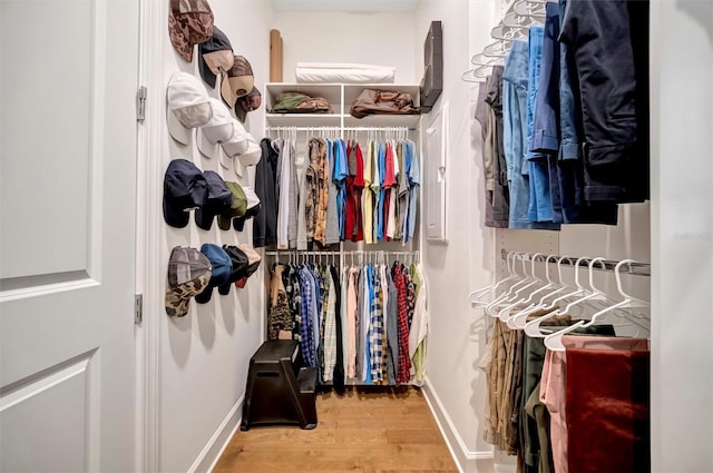 spacious closet featuring light hardwood / wood-style floors