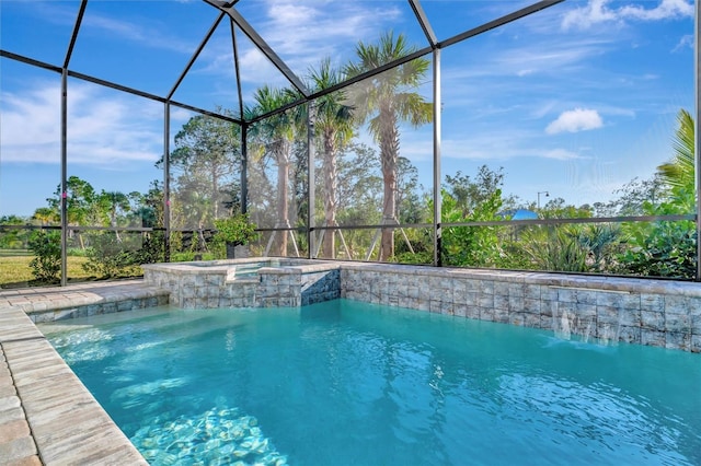 view of pool featuring an in ground hot tub and a lanai