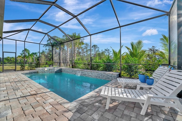 view of pool with a lanai and a patio area