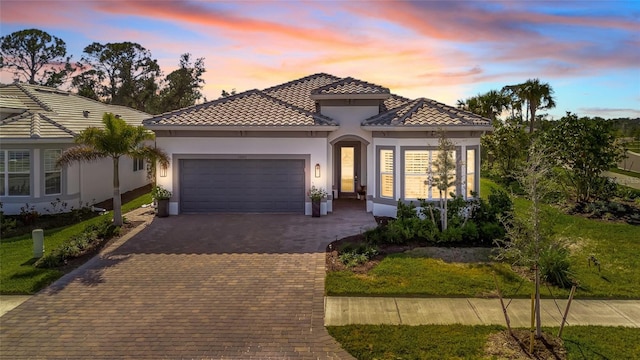 mediterranean / spanish-style home featuring a garage