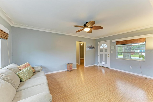 unfurnished living room with crown molding, ceiling fan, and light hardwood / wood-style floors